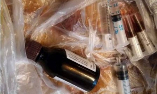 Дома у павлоградцев нашли опий, марихуану и боеприпасы 